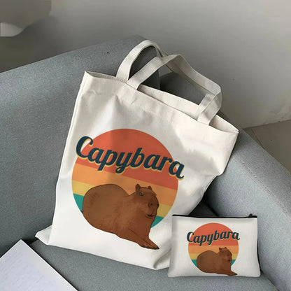 pack capibara tumbado con un sol multicolor a la espalda