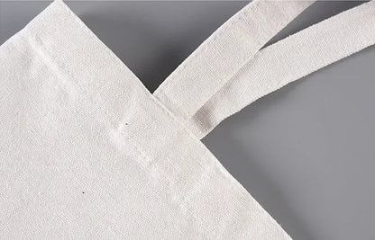 imagen cosido de las asas de la bolsa de tela